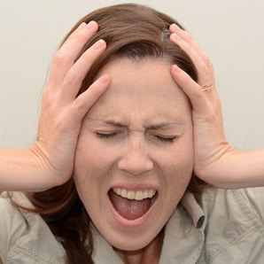 45837314 - screaming young woman face (age 30-40). concept photo of stress and anxiety.