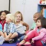 24488730 - group of elementary pupils in classroom listening to teacher