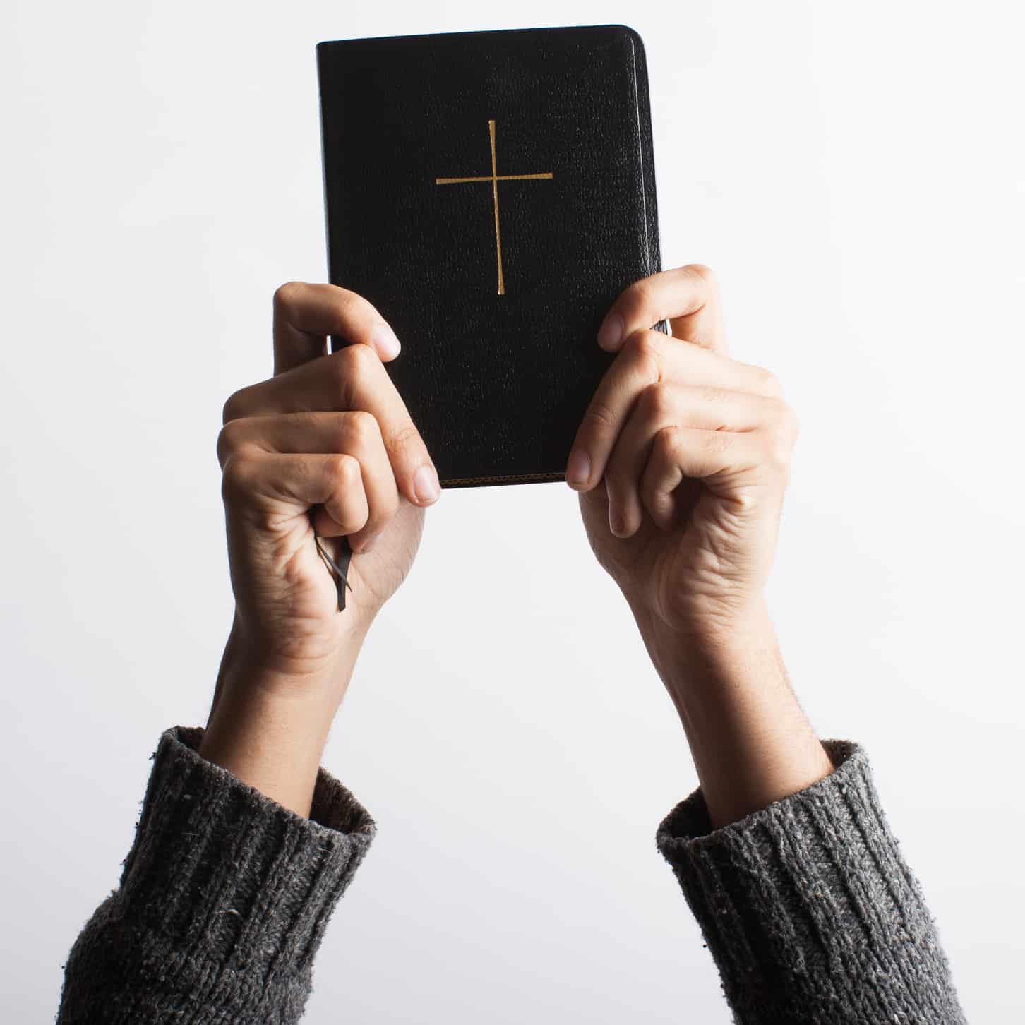 hands on a bible